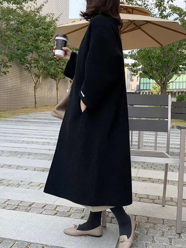 Women's chic long open front winter coat, elegant oversized outerwear for versatile seasonal style.