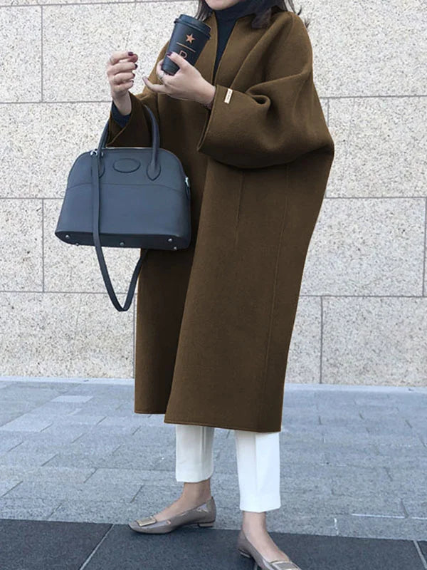 Chic women's oversized long open front coat, versatile for layering and stylish cold-weather outfits.