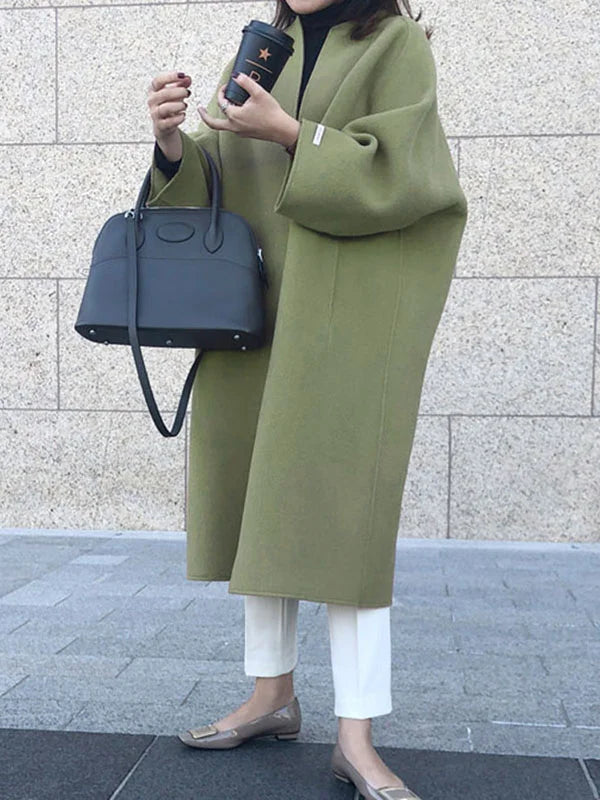 Women's open front long winter coat with a chic oversized fit, a versatile layering piece for style.