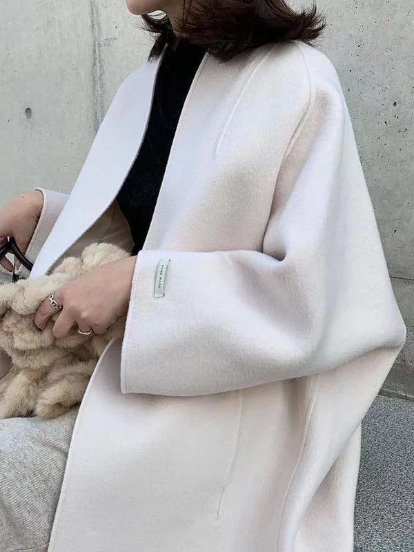 Stay warm & stylish in this women's long open front winter coat, a comfortable layering outerwear piece.