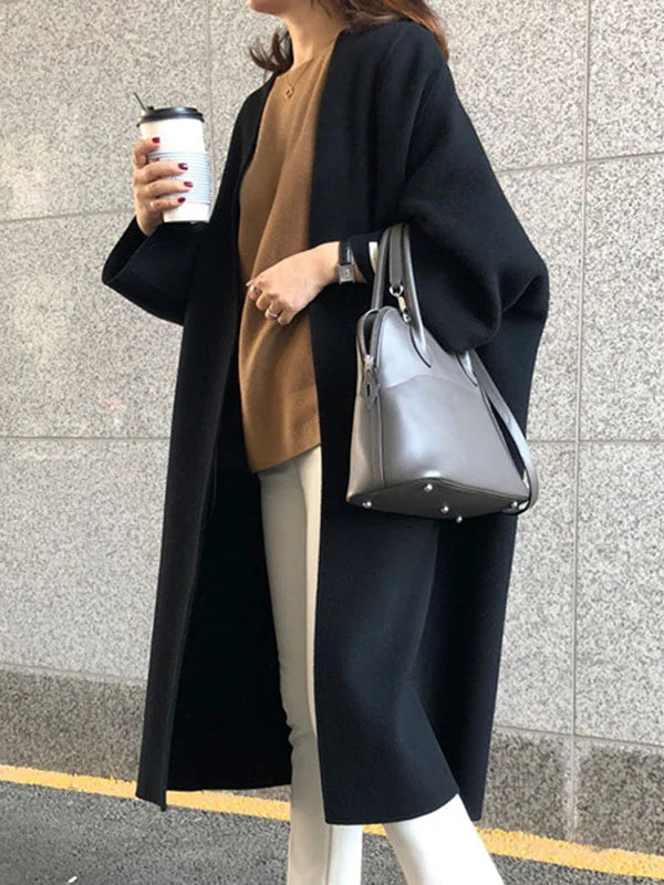 Versatile women's long open front winter coat, an essential oversized outerwear for comfortable layering.