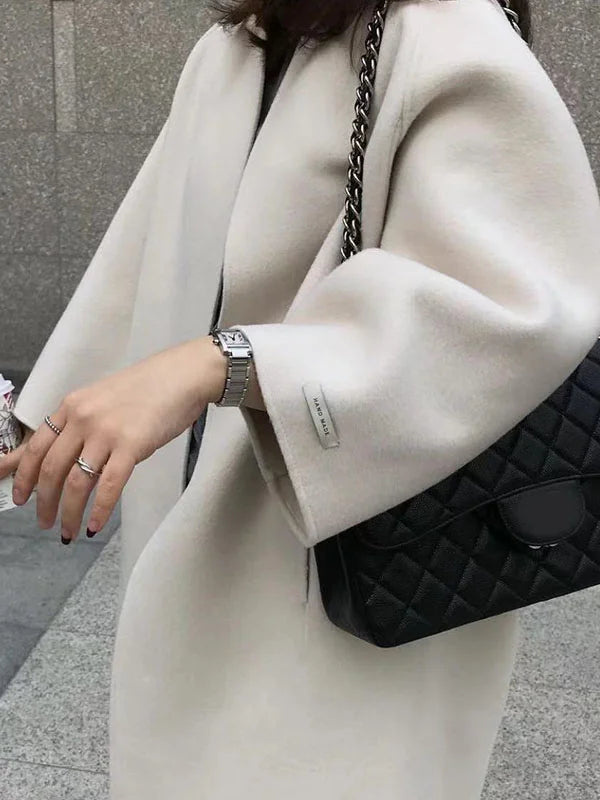 Stylish women's long open front winter coat, comfortable for chic fall and winter layering.