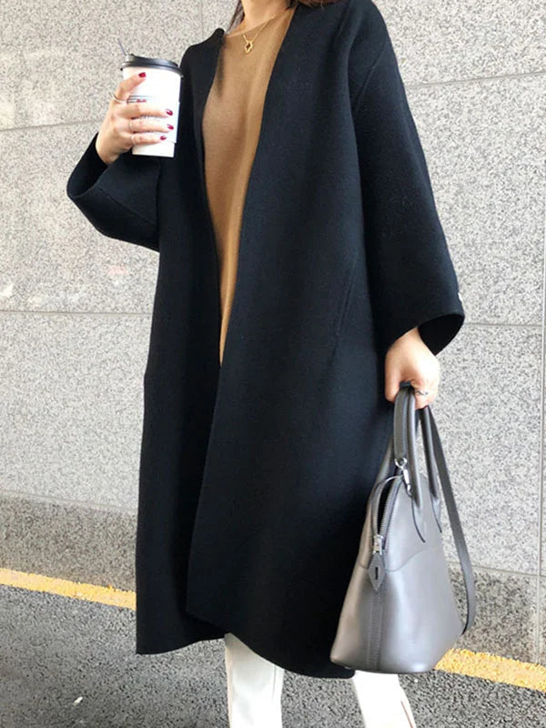 Women's long open front winter coat, an oversized layering piece for elegant cold-weather fashion.