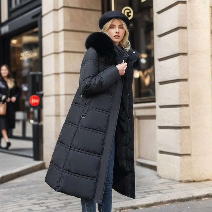 Warm women's hooded long puffer coat featuring a luxurious faux fur trim, ideal for winter style.