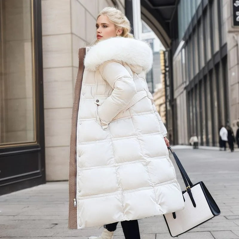 Women's hooded long puffer coat, offering a stylish look with a soft faux fur collar for winter warmth.