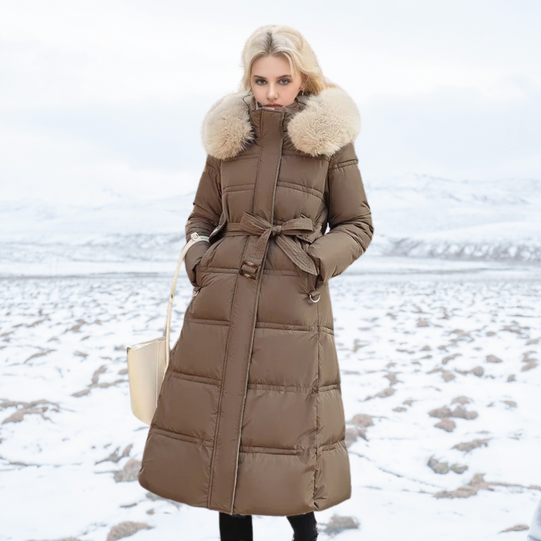 Chic women's long winter puffer coat with a faux fur-lined hood, perfect for elegant cold weather fashion.