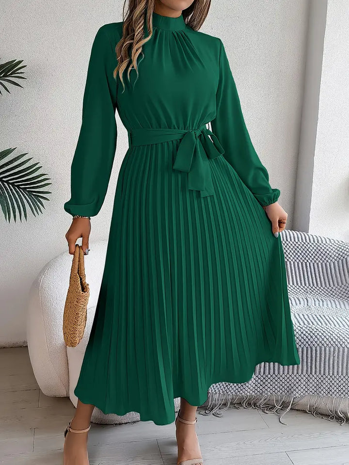 Stylish pleated long-sleeve midi dress for women, belted & elegant for versatile fall/winter occasions.