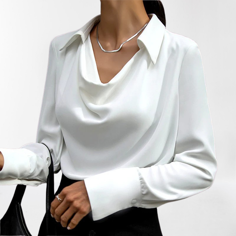 New women's sophisticated chic blouse. This stylish long sleeve top offers a luxurious fit for work or fashion.
