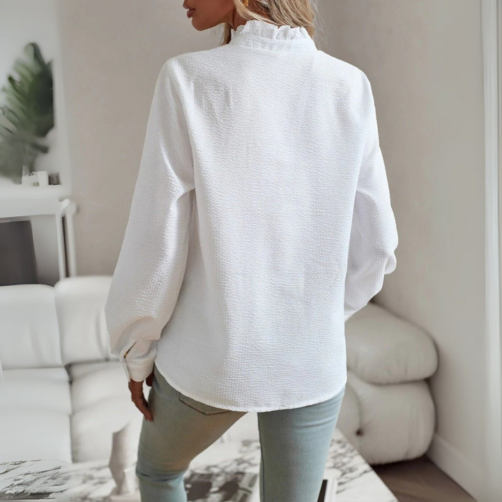 Chic new women's long-sleeve blouse. An elegant top offering versatile style for office & casual fashion.