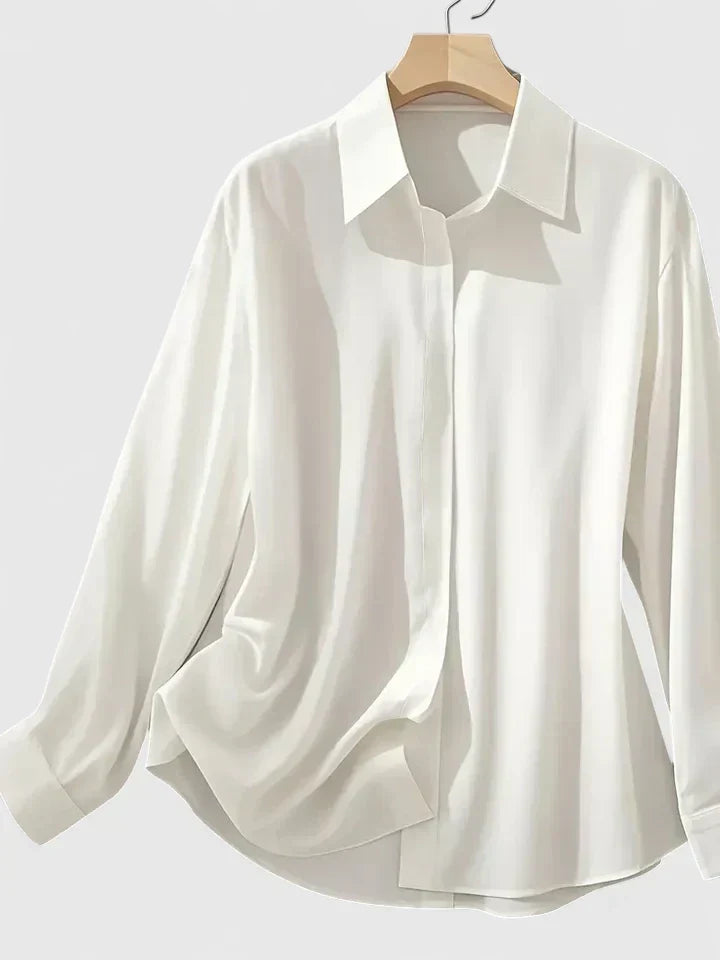 Elegant women's long-sleeve button-down top, perfect for sophisticated office wear or a chic everyday look.