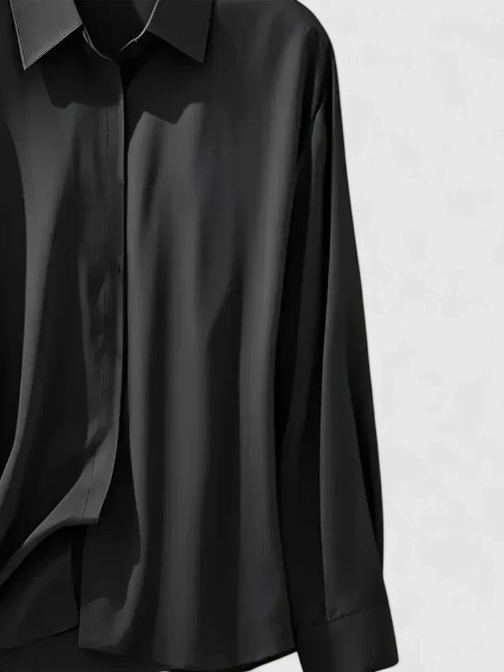 Polished women's long-sleeve button-down blouse, an elegant and sophisticated top for various occasions.