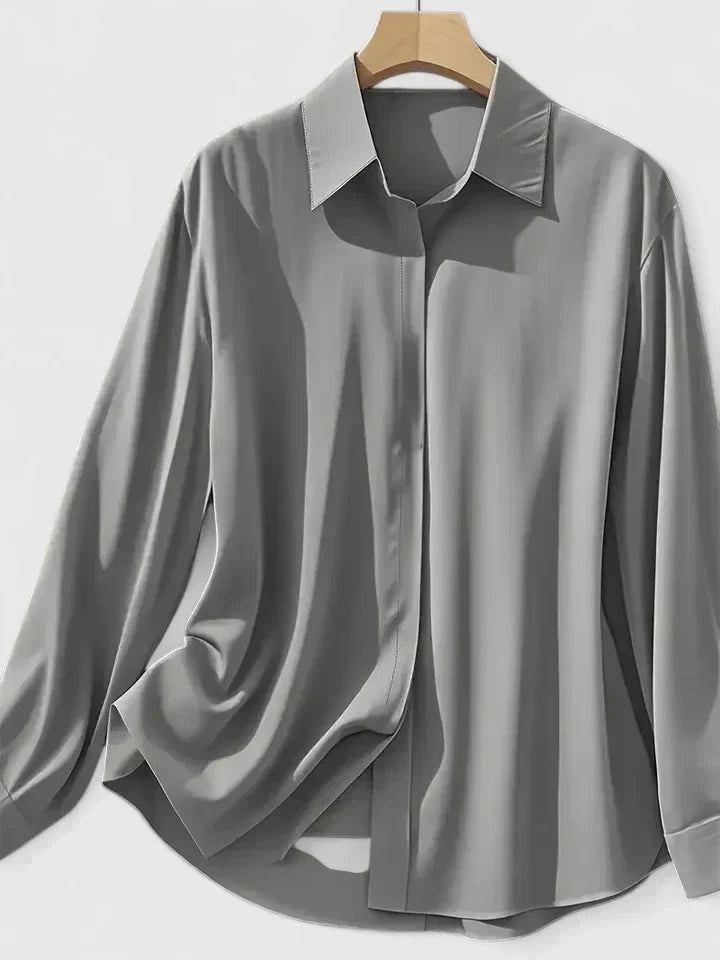 Versatile women's button-down blouse, ideal long-sleeve top for office, casual chic, and elegant occasions.