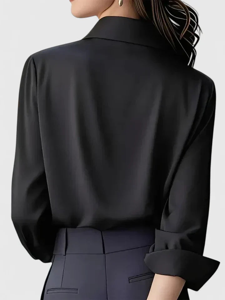 Classic women's fashion top; a sophisticated long-sleeve button-down blouse for versatile styling options.
