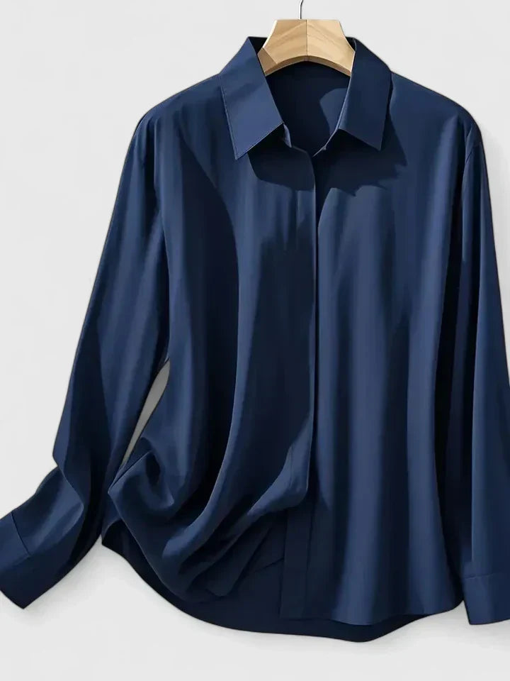 Sophisticated women's long-sleeve button-down top, an elegant blouse designed for professional office wear.