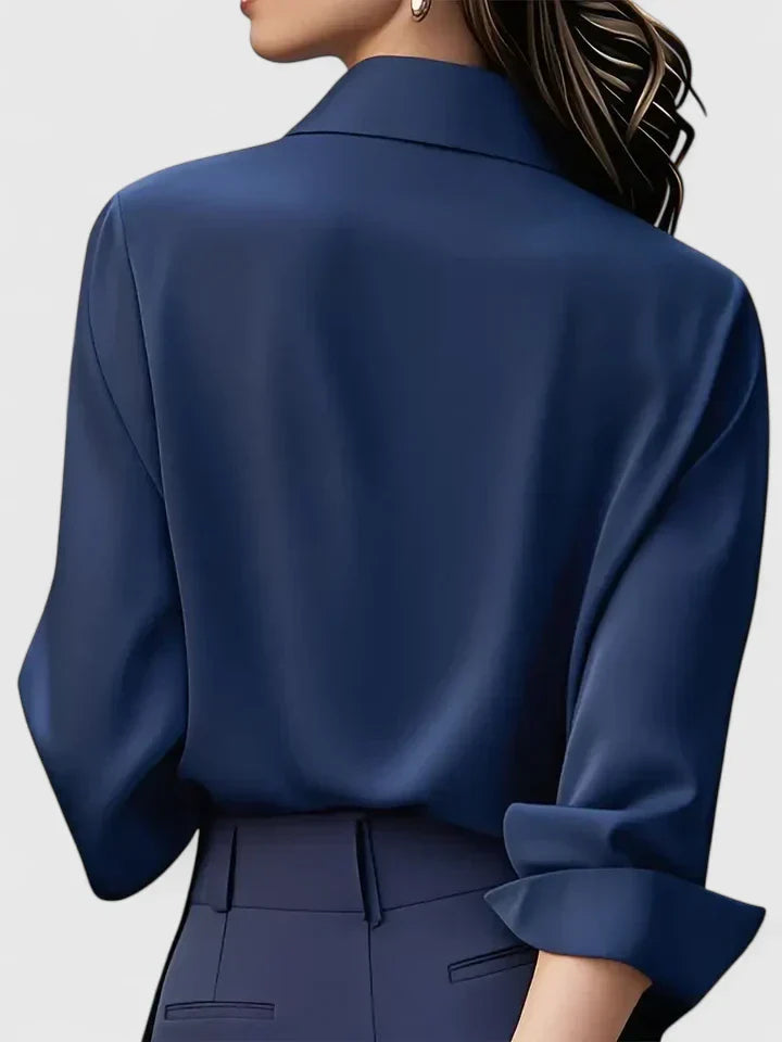 Front view of a women's elegant long-sleeve button-down top, perfect as an office wear or fashion blouse.