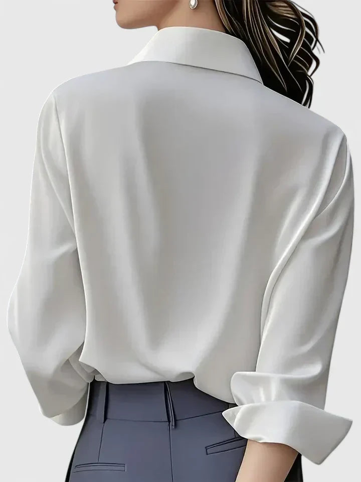 Stylish women's long-sleeve button-down top, an elegant everyday blouse for a polished and casual chic look.