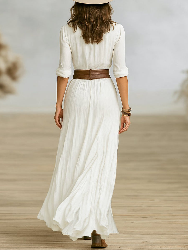 Women's v-neck long-sleeve maxi dress, elegant and versatile with button-front and beautiful pleats.