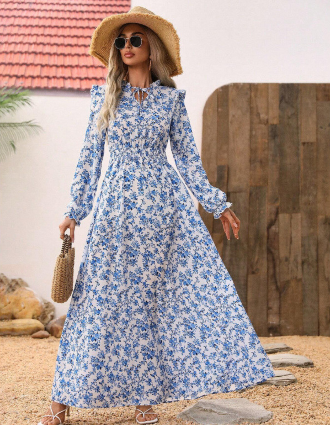 Back view of a flowing women's elegant long sleeve floral A-line midi dress, suitable for casual or special occasions.