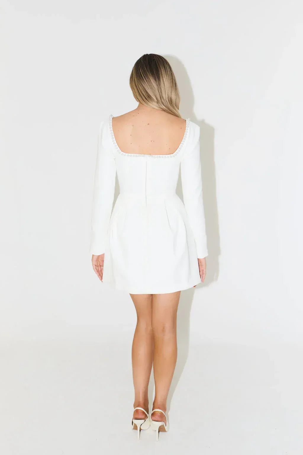 Women's fashion: elegant long sleeve mini dress with pearl trim, a must-have for evening special occasions.