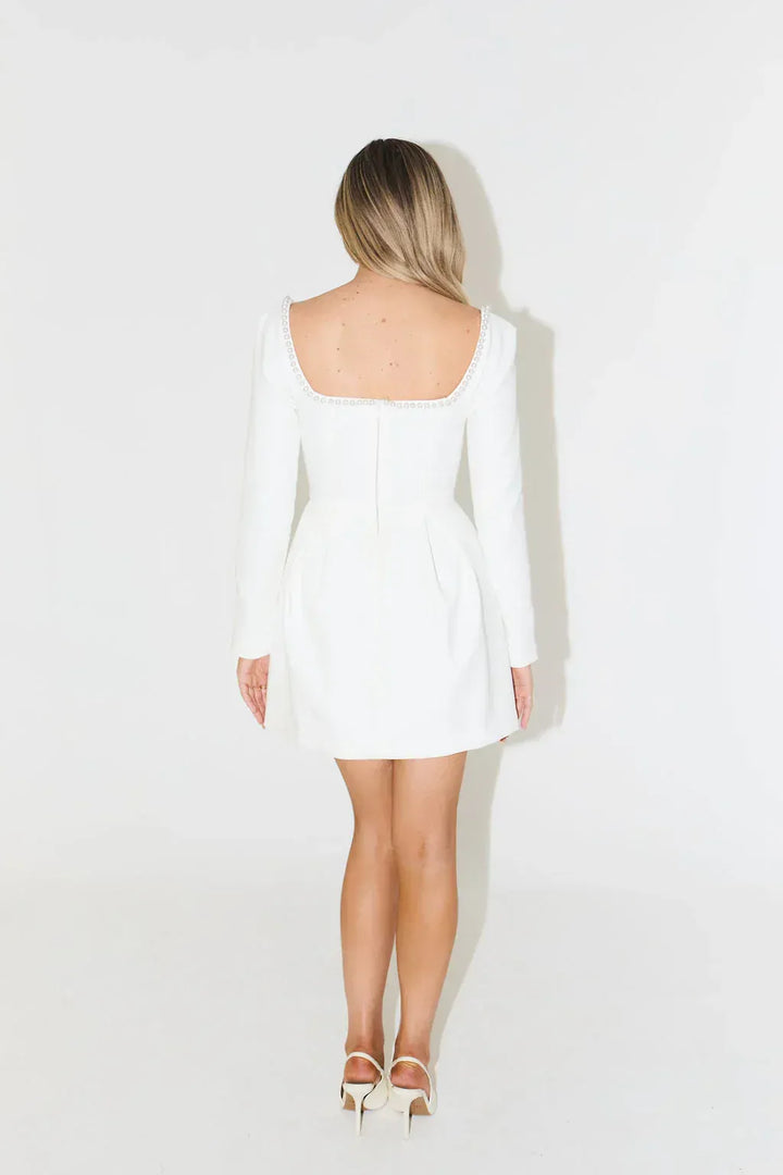 Women's fashion: elegant long sleeve mini dress with pearl trim, a must-have for evening special occasions.