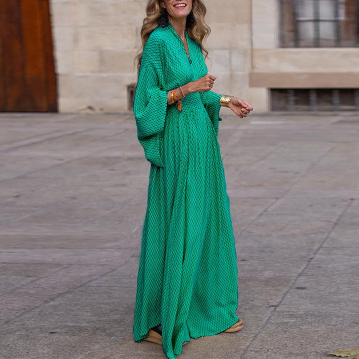 Flowy green women's long sleeve V-neck midi dress, offering comfortable elegance for any casual or dressy occasion.