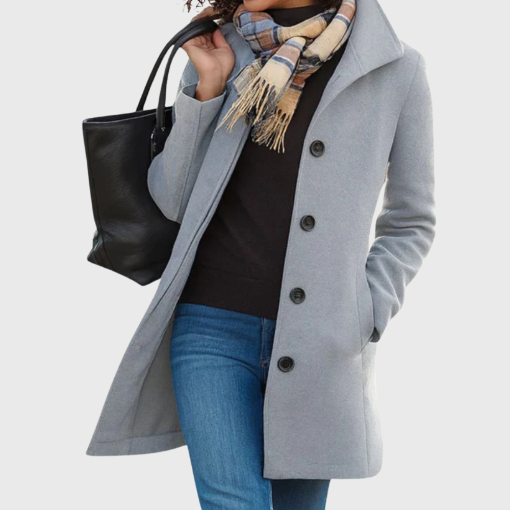 Stylish women's longline coat, featuring elegant buttons, a perfect sophisticated layering piece.