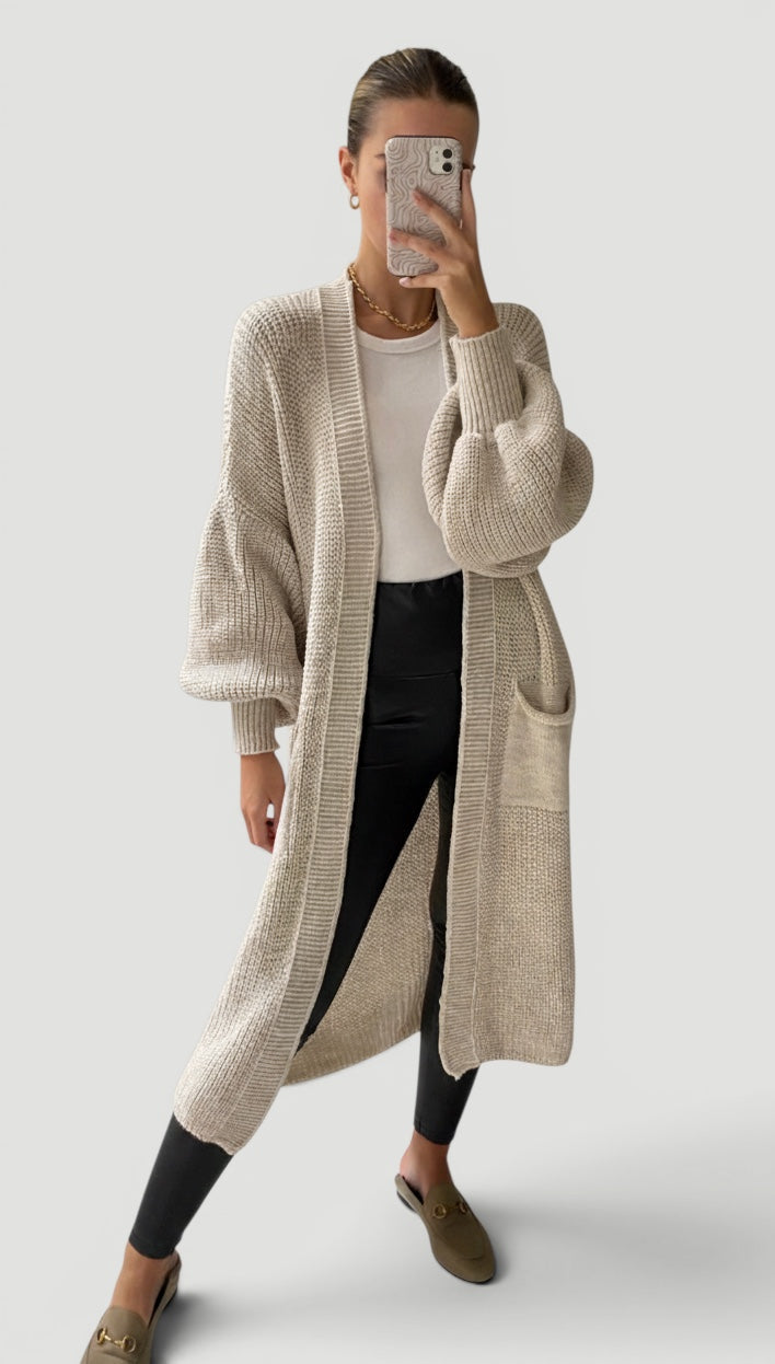 Versatile women's longline cardigan with graceful bell sleeves for a relaxed fit.