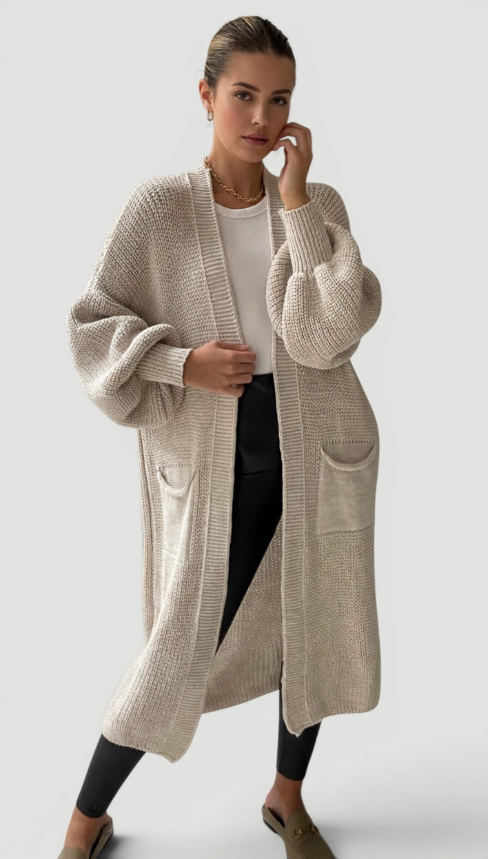 Sophisticated women's longline outerwear, featuring stylish bell sleeves and open front.