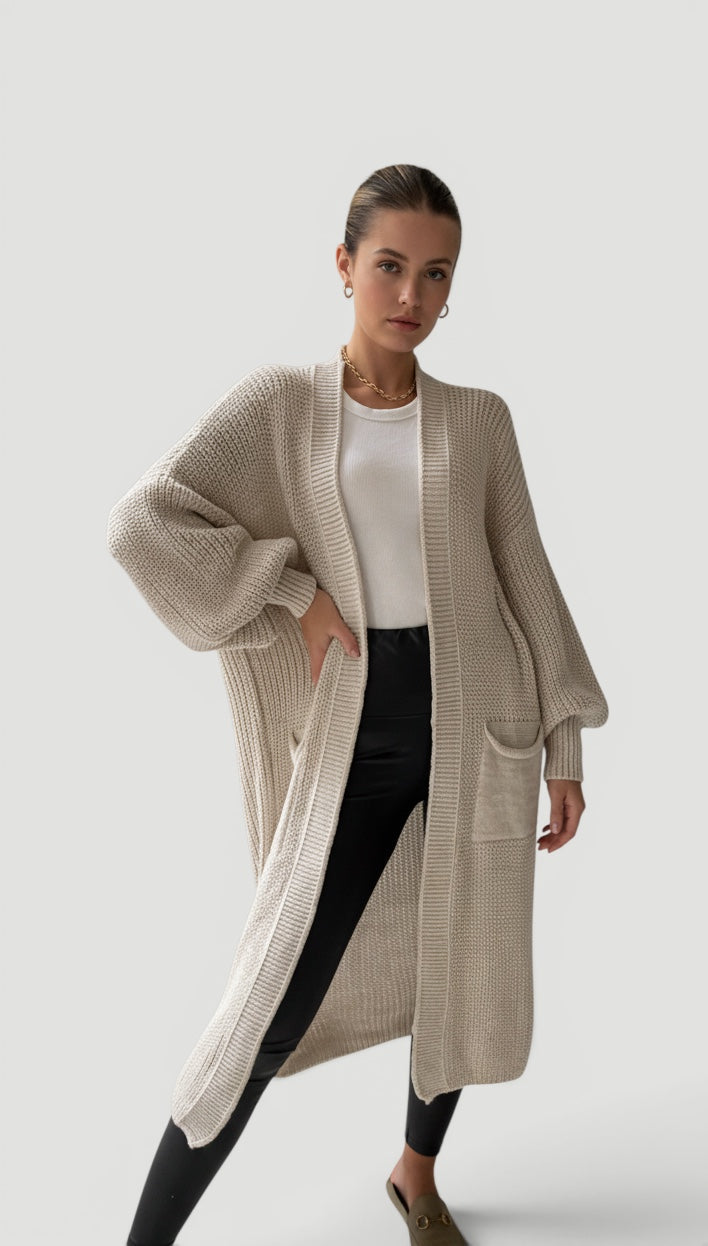 Chic women's elegant longline cardigan with flowy bell sleeves, ideal for layering.