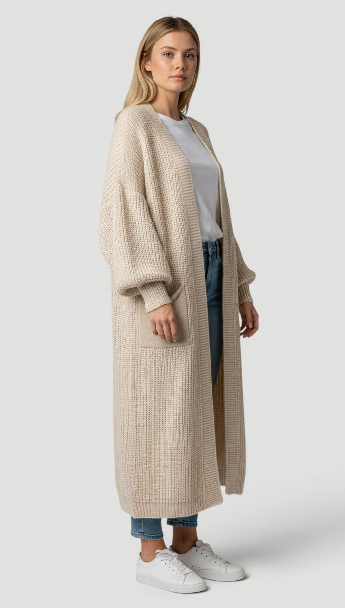 Cozy women's longline bell sleeve cardigan, a stylish and versatile outerwear piece.