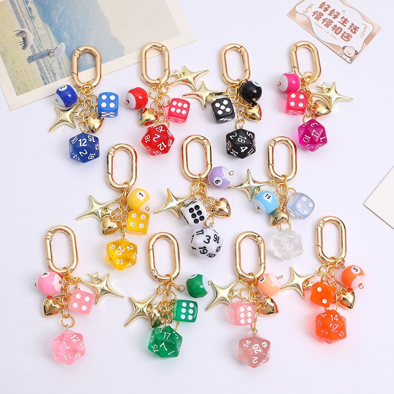 Elegant women's lucky charm keychain with colorful beads & shiny metal dice, perfect bag accessory & key organizer.
