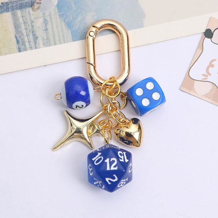 Fashionable women's lucky charm keychain, colorful beads, metal dice, stylish bag & key accessory. Elegant gift.