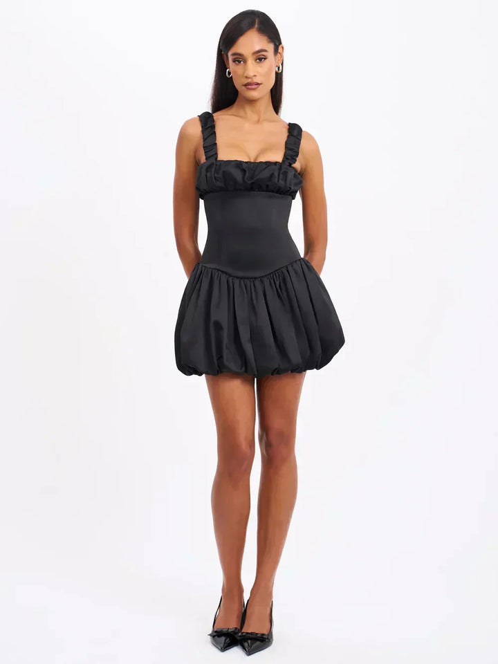 Luxurious women's elegant ruffle mini dress. Chic summer party wear with a flattering fit for sophisticated occasions.