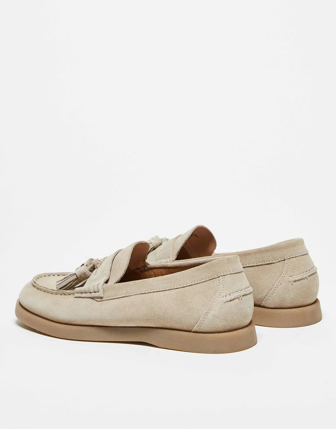 Sophisticated women's slip-on tassel loafers. New luxury footwear, perfect for dressy or casual outfits.