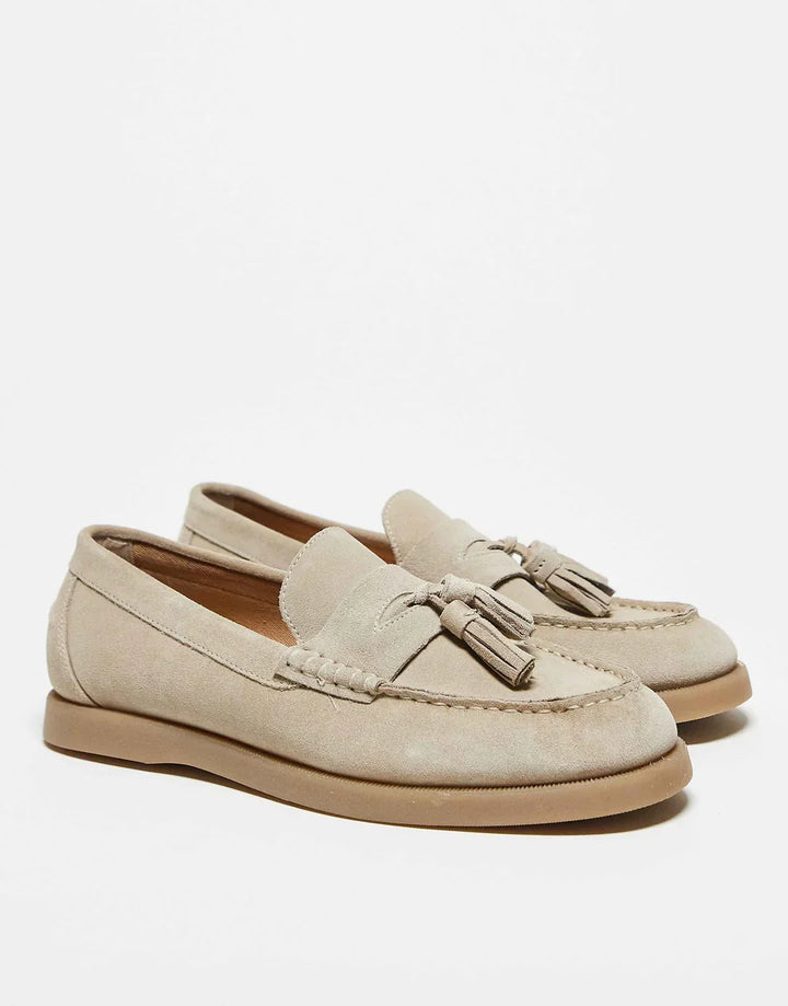 Close-up of women's comfortable tassel loafers, showcasing elegant design & quality for a polished look.