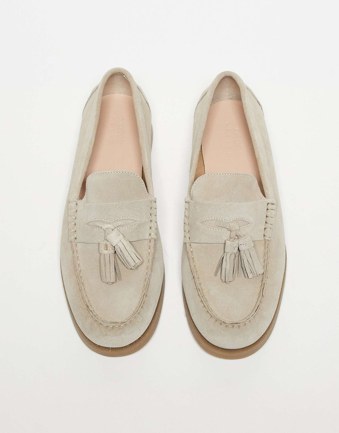 Women's versatile luxury tassel loafers. Chic slip-on footwear, combining elegance and all-day comfort.