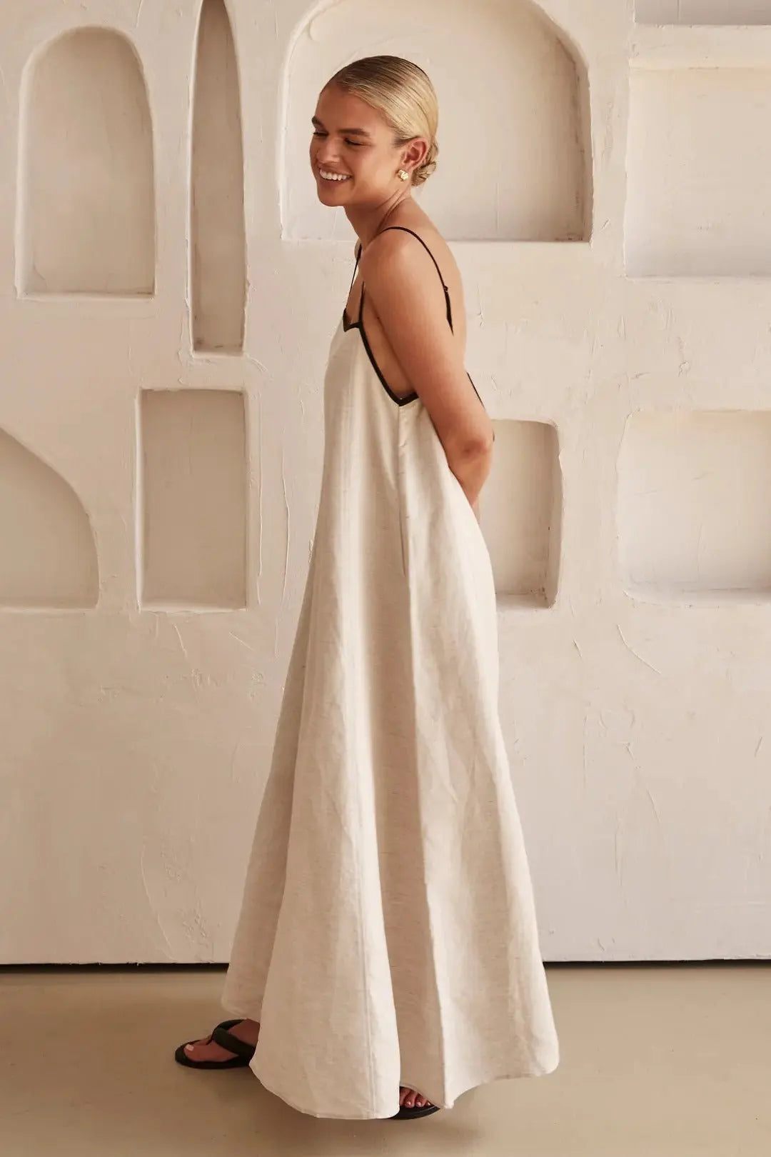 Beautiful women's summer maxi dress with adjustable straps and a sophisticated contrast trim, great for day or night.