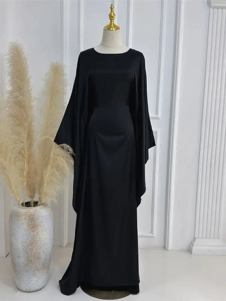 Elegant women's maxi dress with spaghetti straps & high slit, perfect for evening events.