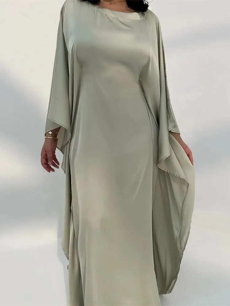 Graceful women's party dress, elegant maxi style with delicate spaghetti straps & a chic high slit.