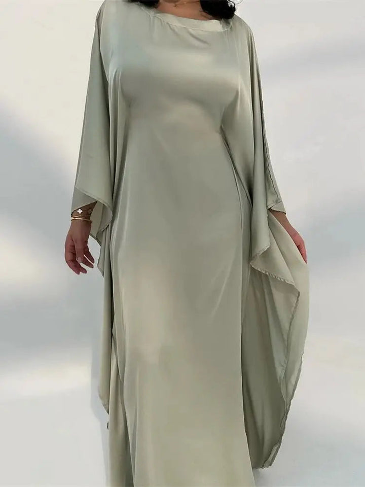 Graceful women's party dress, elegant maxi style with delicate spaghetti straps & a chic high slit.