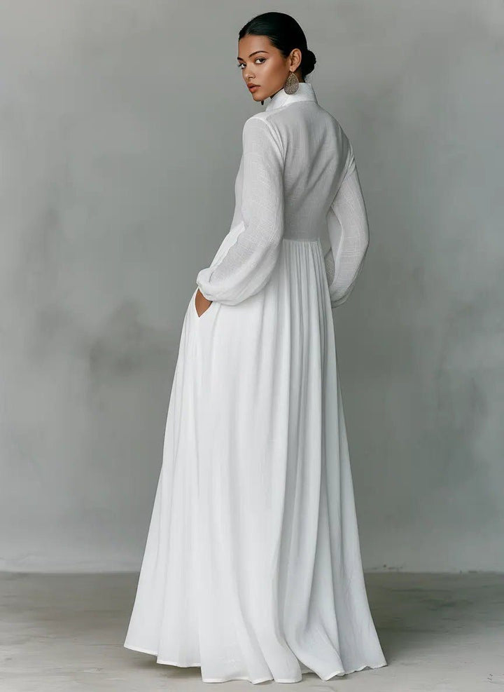 Woman models a chic elegant maxi shirt dress with stand collar and pockets, ideal for spring/summer casual wear.