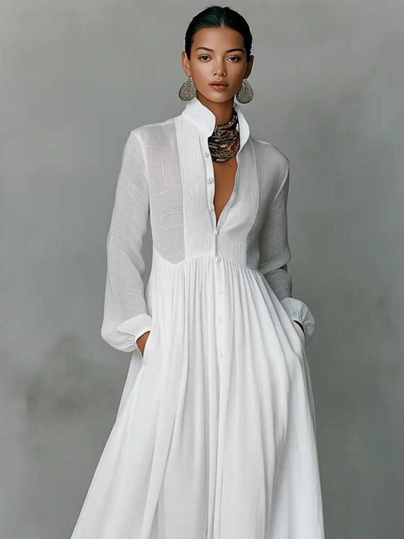 Back view of a women's flowing maxi shirt dress, showcasing its elegant length and comfortable design for day wear.
