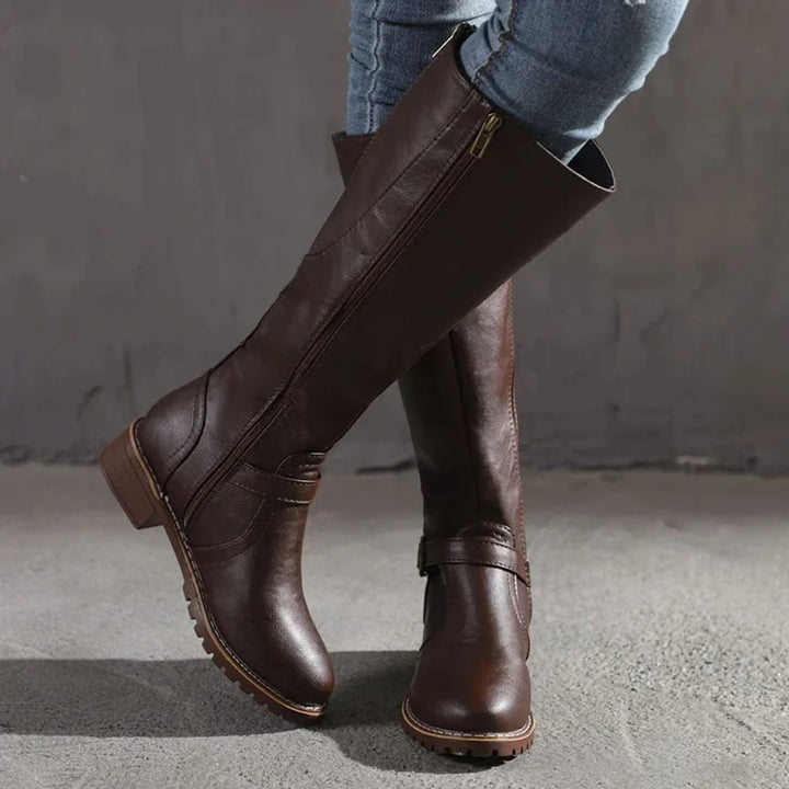 Stylish women's mid-calf boots, versatile for fall fashion. Classic, comfortable footwear with side zipper.