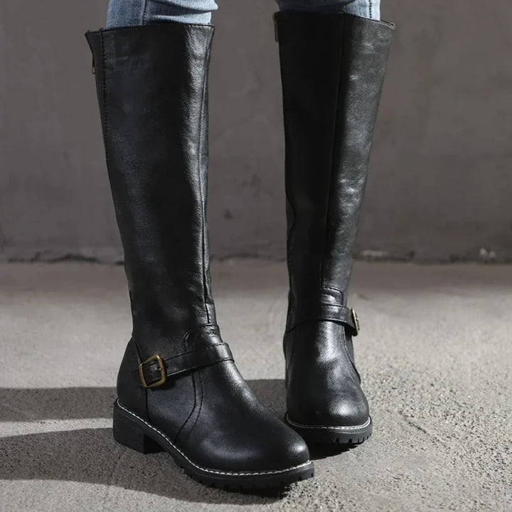 Classic women's mid-calf boots, elegant for winter & fall. Comfortable, versatile footwear, perfect for stylish outfits.