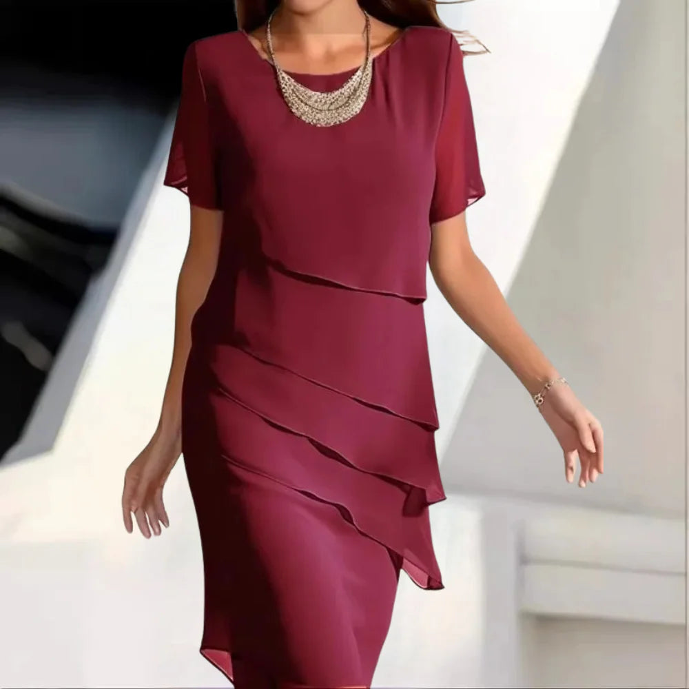 Women's elegant midi length dress, a comfortable and versatile apparel choice for any summer occasion.