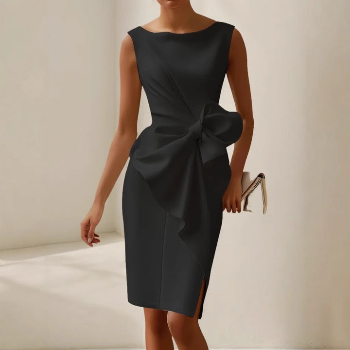 Chic wedding guest midi dress with a beautiful bow, a stunning choice for special events.