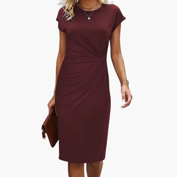 Sophisticated women's midi dress, round neckline & defined waist, perfect for special occasions & events.