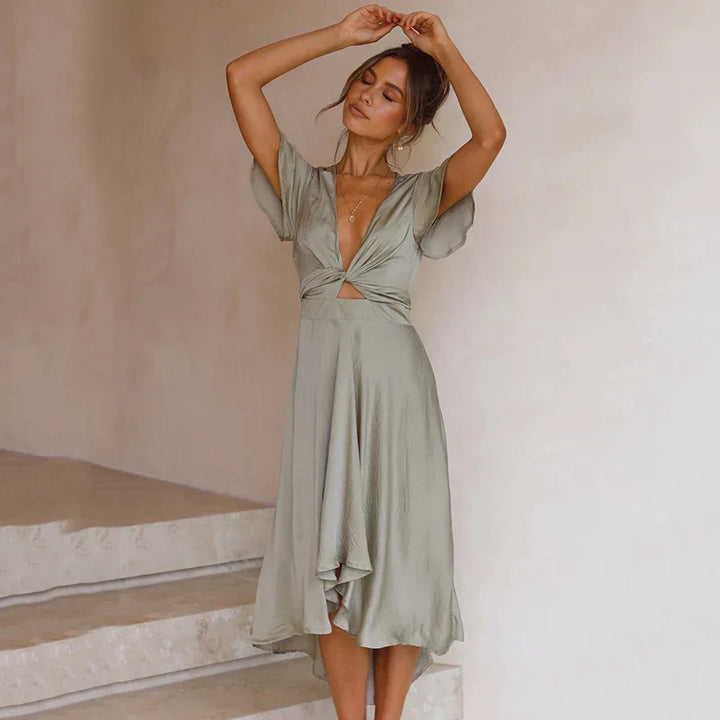 Stylish V-neck midi dress for women, featuring a timeless design suitable for elegant or casual occasions.
