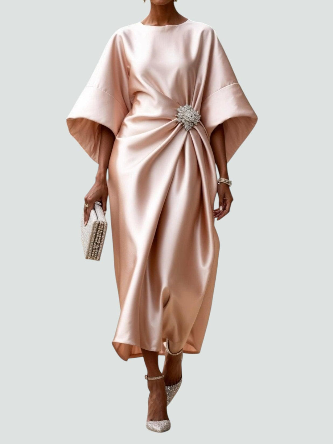 Stylish women's midi dress with a striking brooch accent, draped design, gather waist, suitable for elegant events.