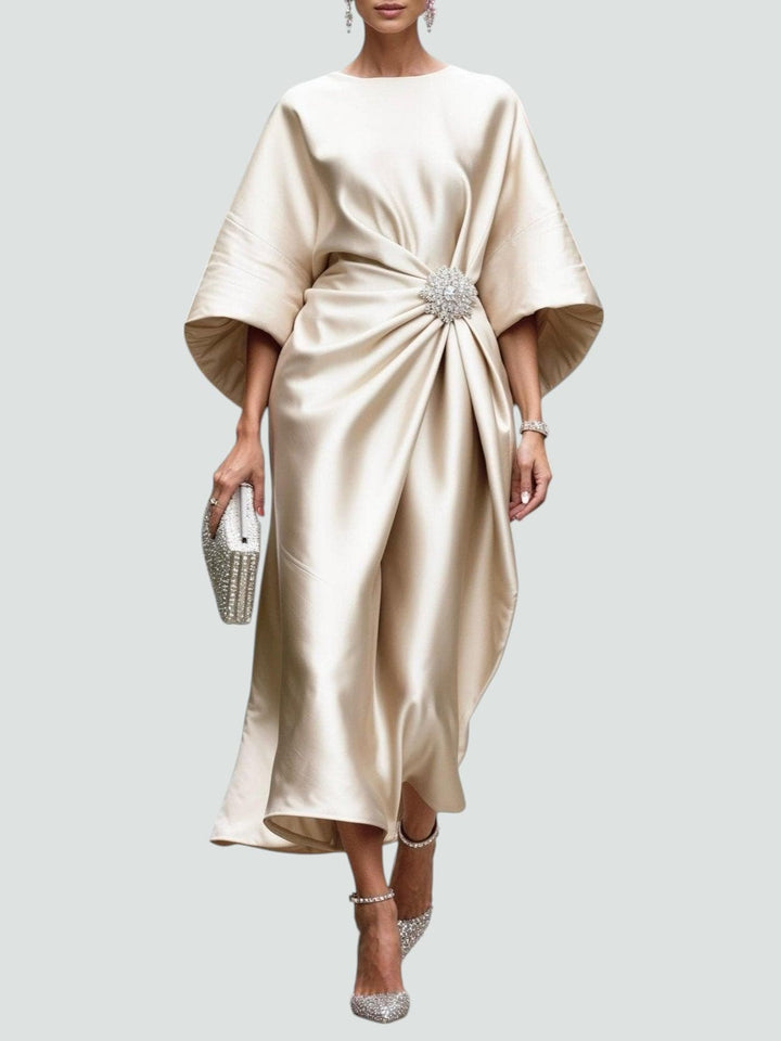Graceful women's elegant midi dress, a stunning special occasion outfit with a brooch, flowing fabric, and tailored fit.